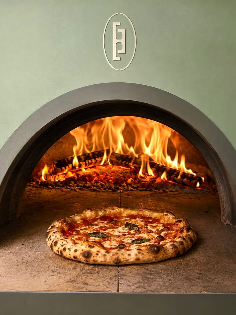 Margherita pizza baking in Le Flambeur